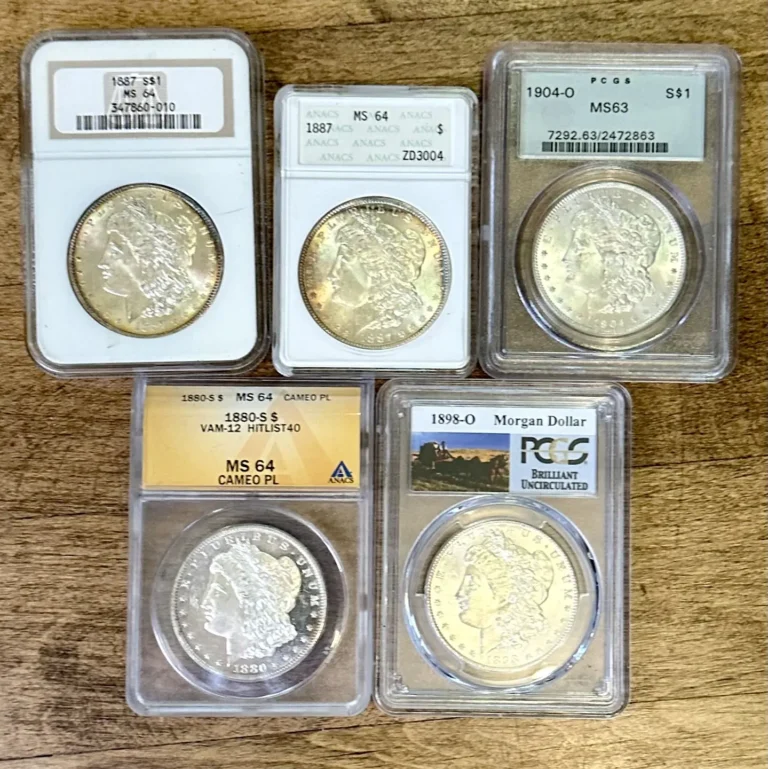 A variety of coins in graded plastic holders