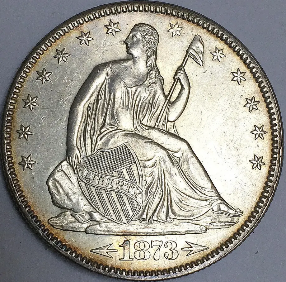 1873 Seated Liberty half dollar, front, with arrows beside the date